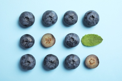 Flat lay composition with tasty blueberry on color background