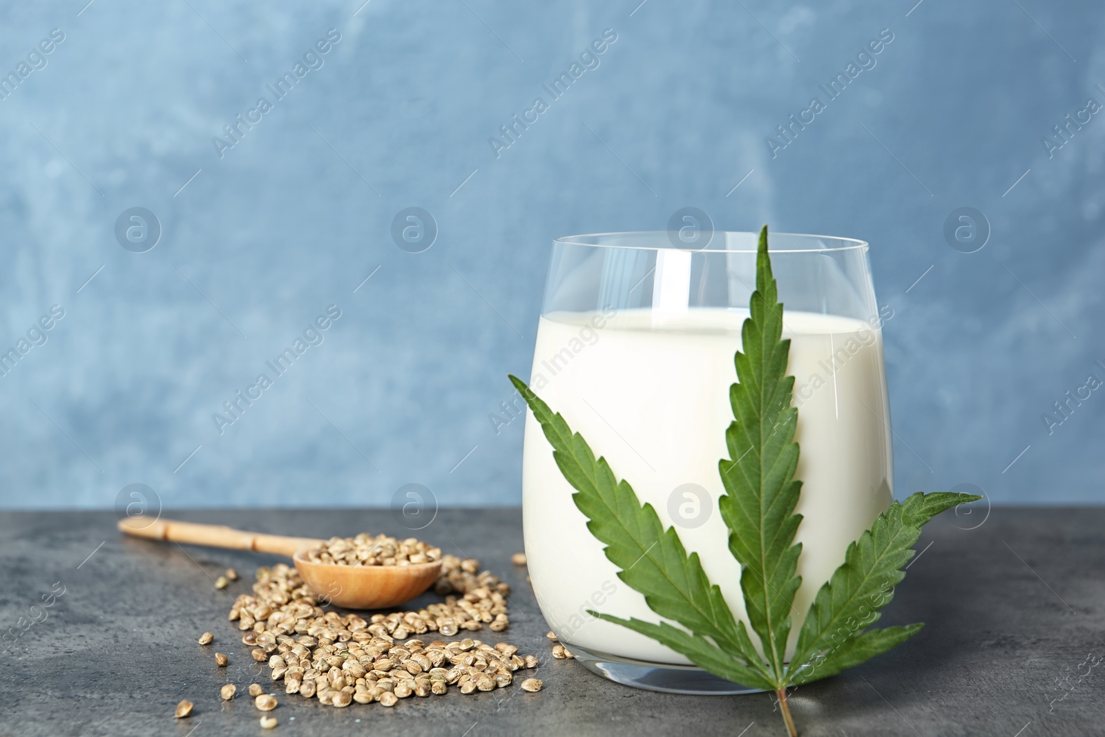 Photo of Composition with hemp milk on grey table