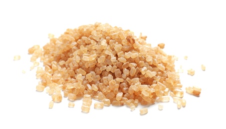 Photo of Pile of brown sugar on white background