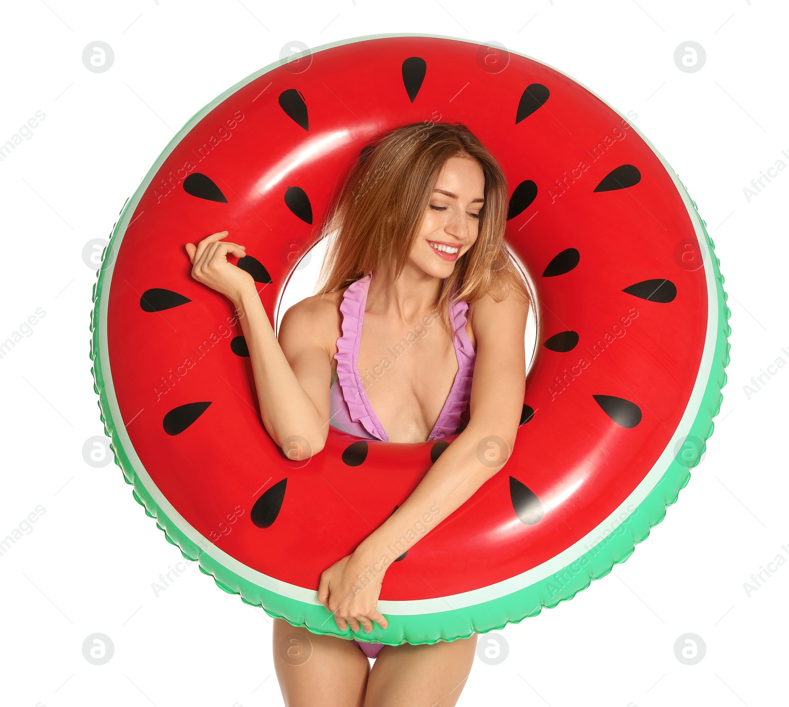 Photo of Beautiful young woman in stylish bikini with watermelon inflatable ring on white background