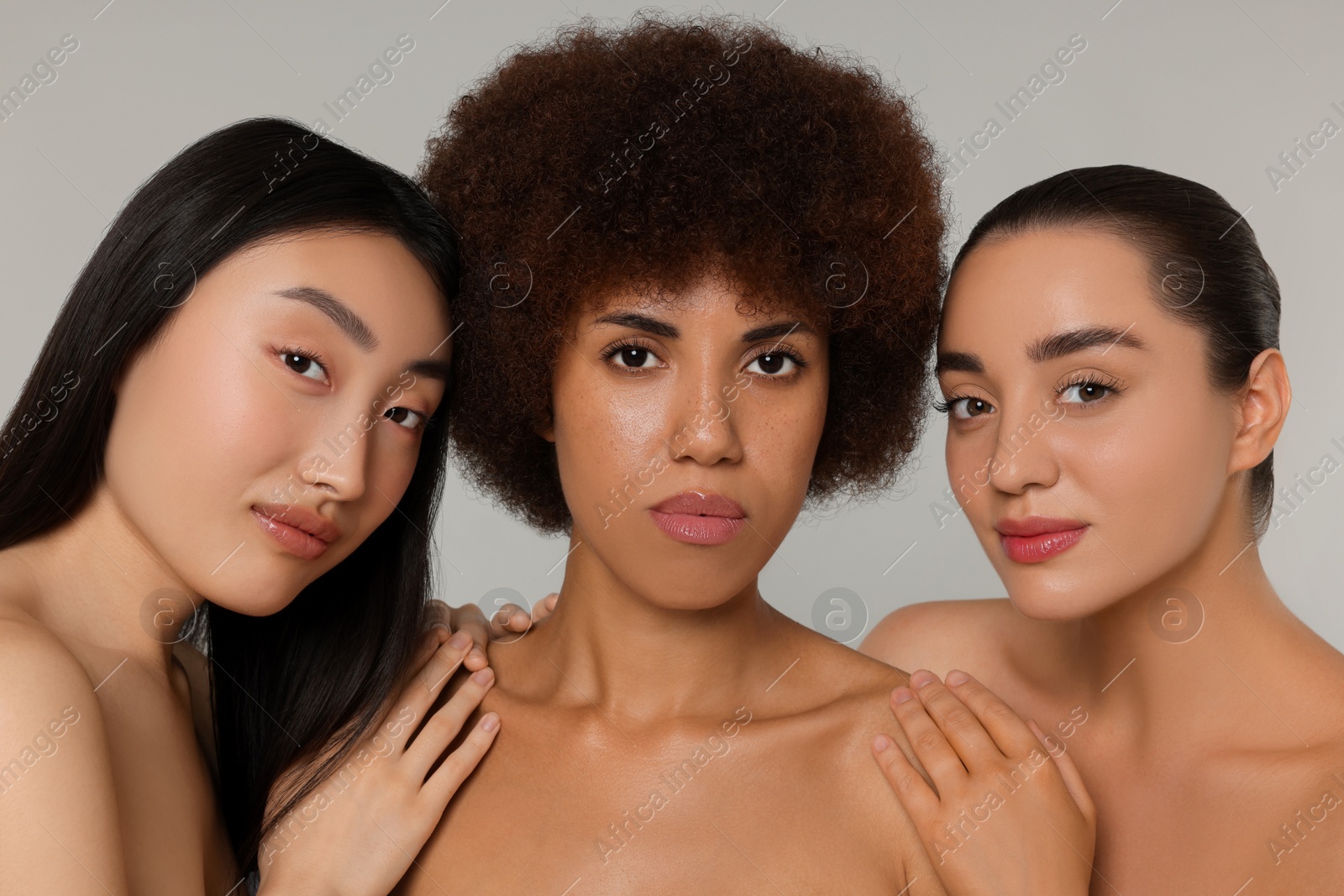 Photo of Portrait of beautiful young women on light grey background