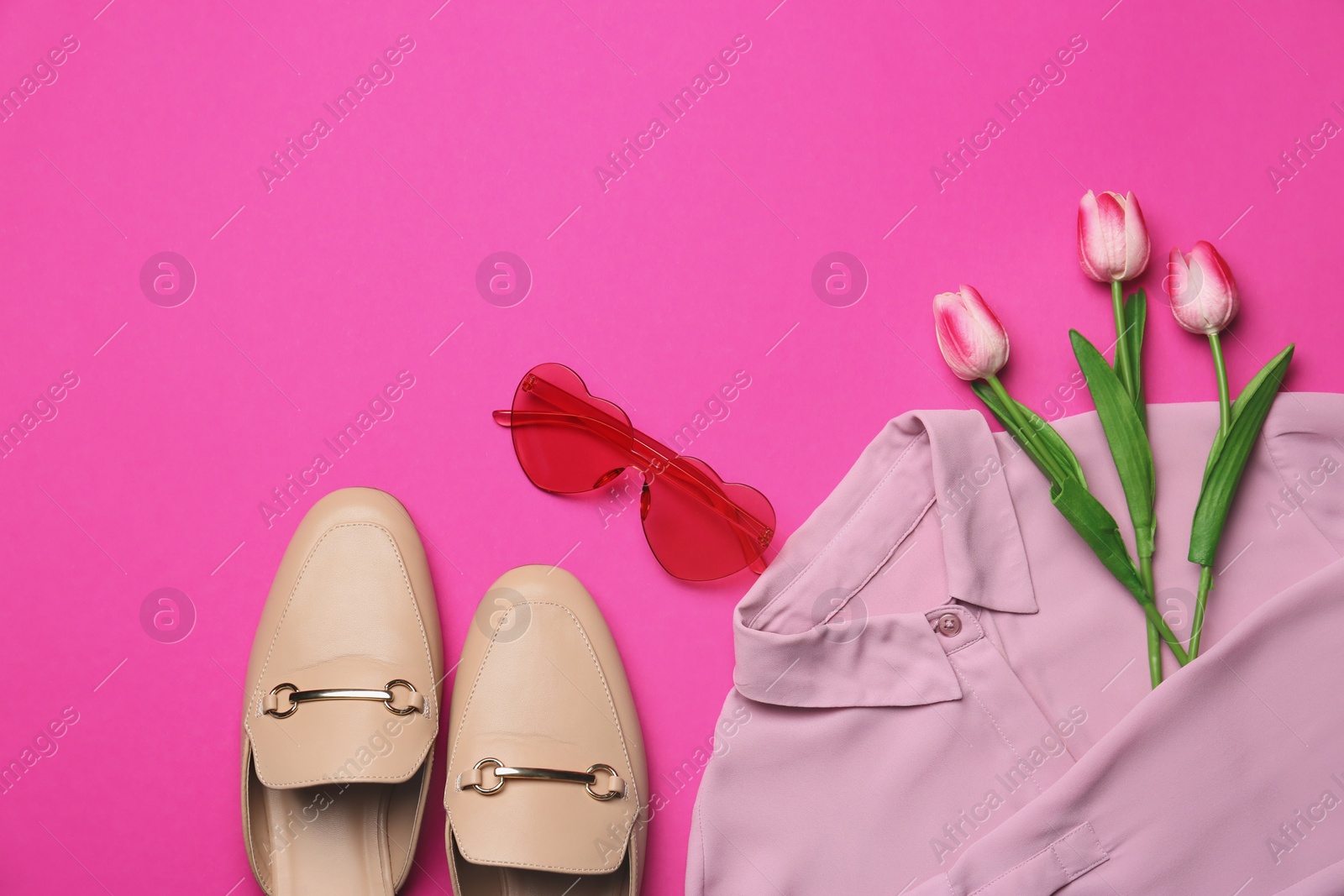 Photo of Flat lay composition with sunglasses and tulip flowers on pink background
