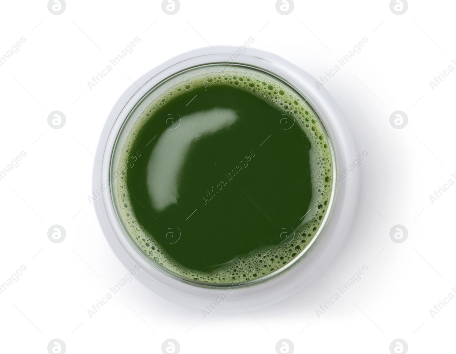 Glass of fresh wheat grass juice on white background, top view Photo of Glass of fresh wheat grass juice on white background, top view