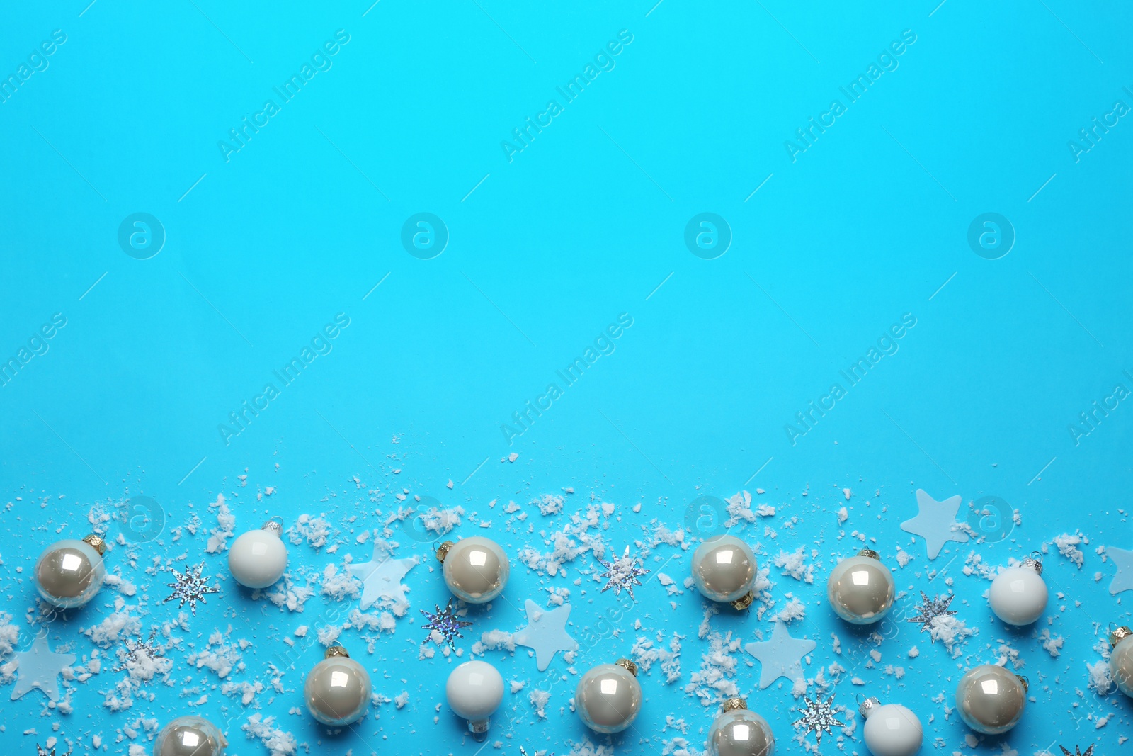 Photo of Flat lay composition with Christmas decorations on blue background, space for text. Winter season