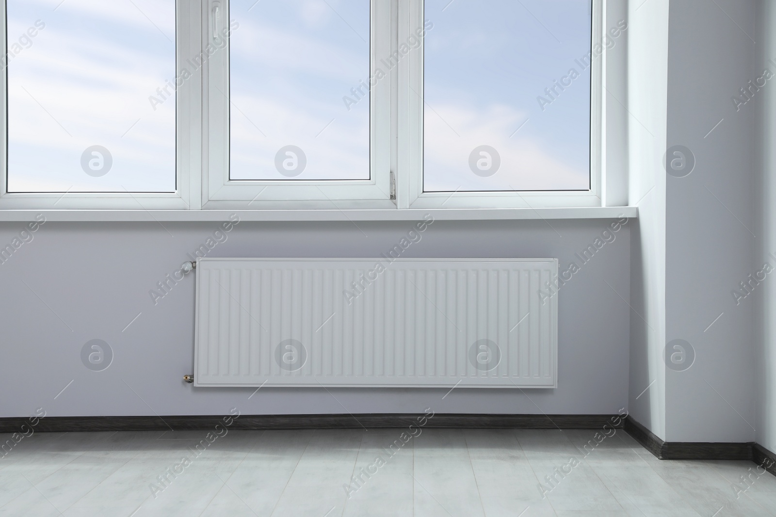 Photo of Modern office with window and radiator. Interior design