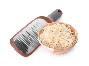 Photo of Grated horseradish in bowl and hand grater isolated on white