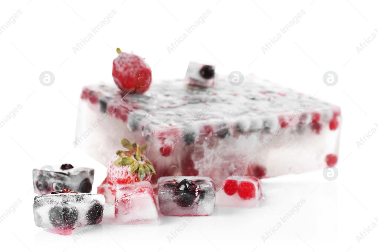 Photo of Fresh berries frozen in ice cubes on white background