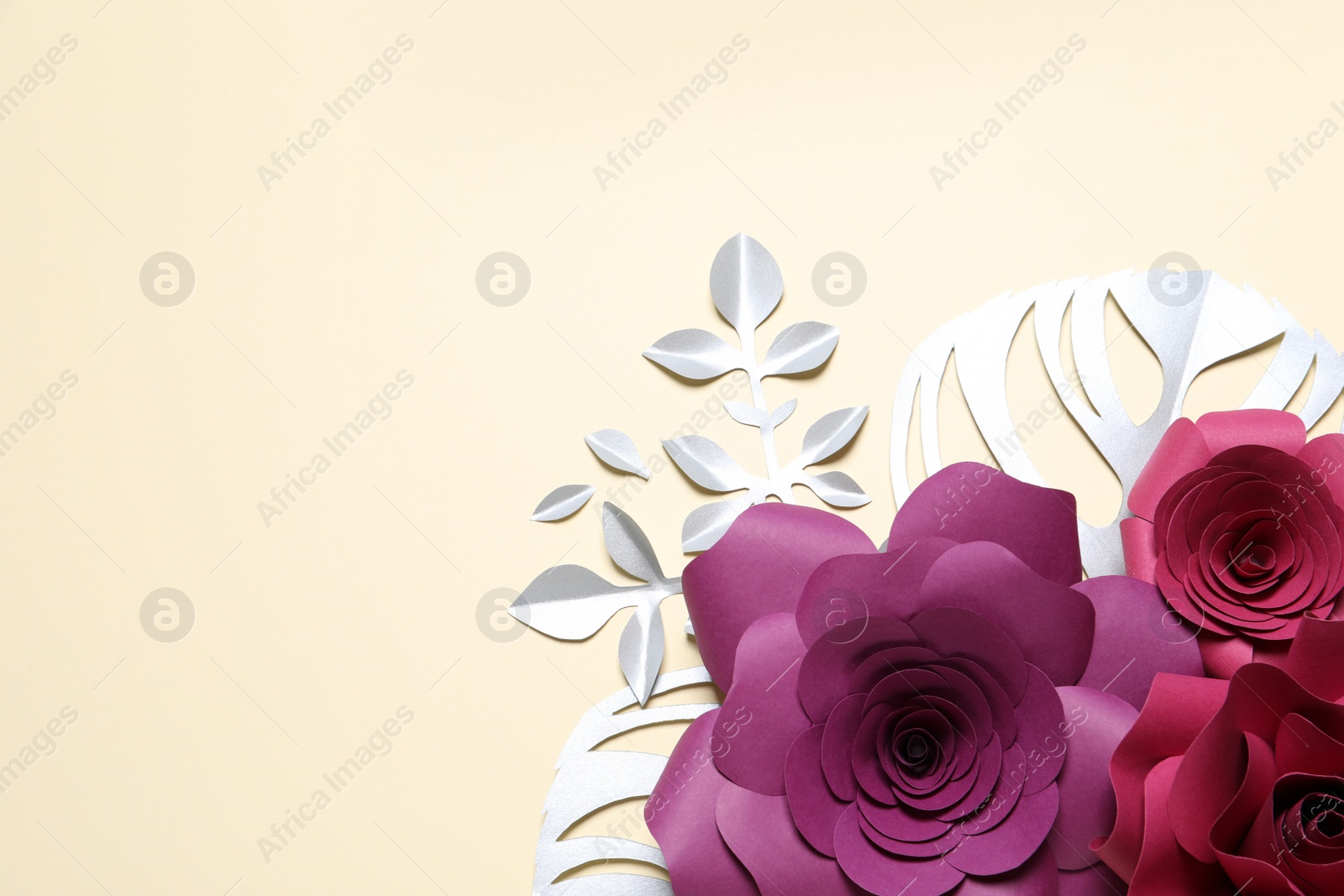 Photo of Different beautiful flowers and branches made of paper on beige background, flat lay. Space for text