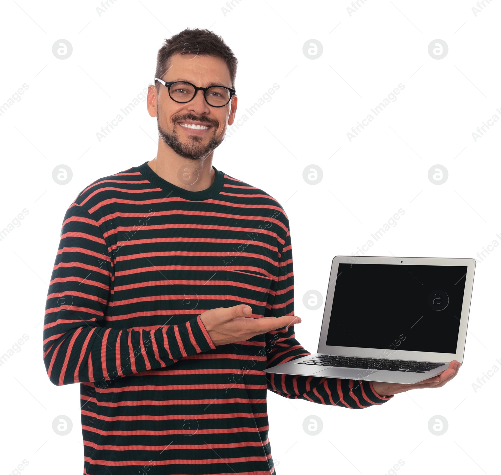 Photo of Smiling man showing laptop on white background