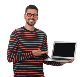 Smiling man showing laptop on white background