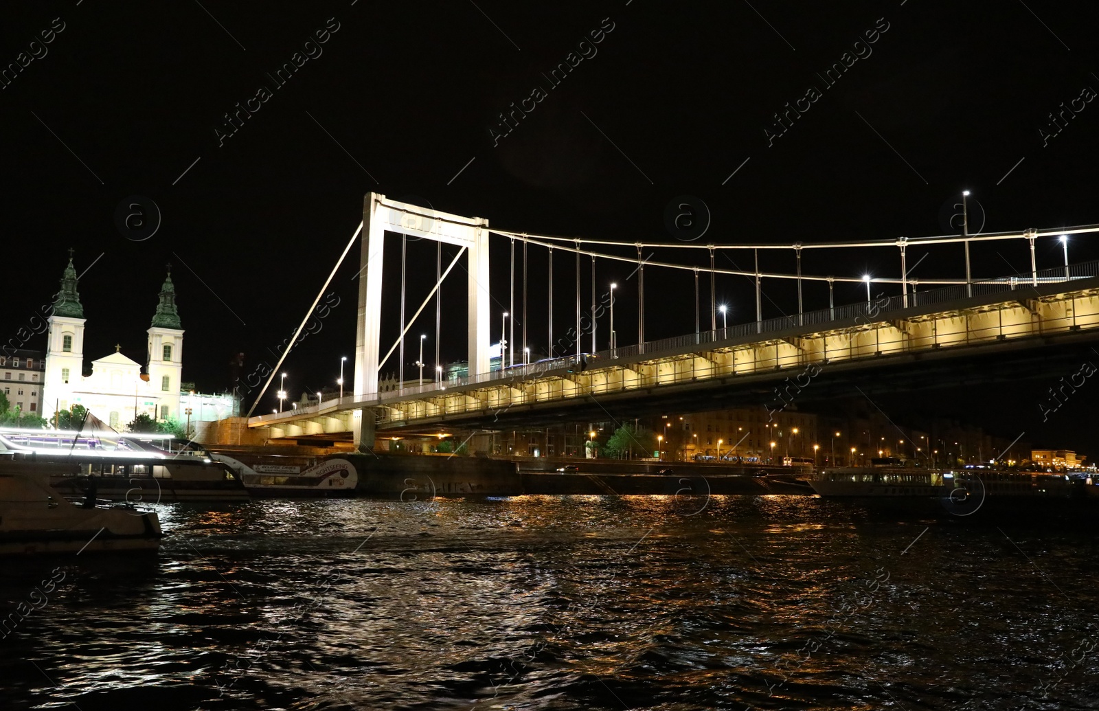 Photo of BUDAPEST, HUNGARY - APRIL 27, 2019: Beautiful night cityscape with illuminated Elisabeth Bridge across Danube river