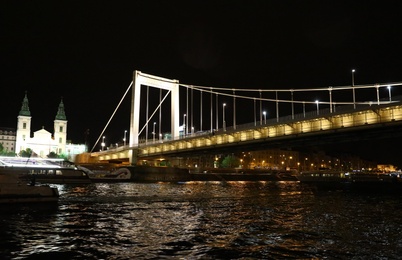 BUDAPEST, HUNGARY - APRIL 27, 2019: Beautiful night cityscape with illuminated Elisabeth Bridge across Danube river