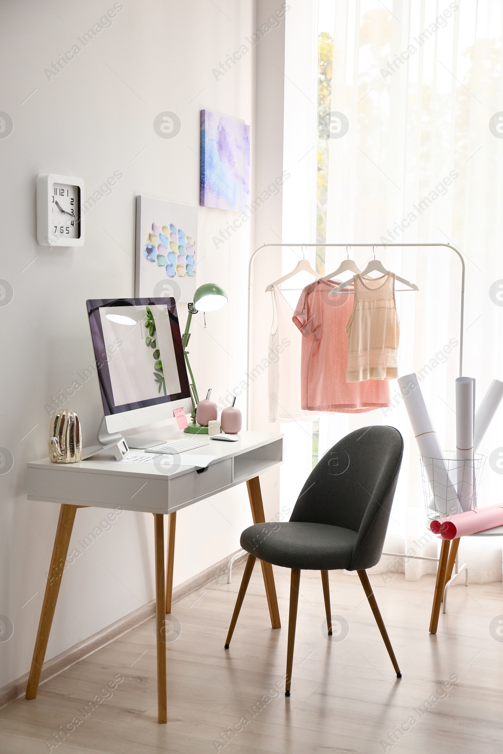 Photo of Designer's workplace with modern computer on table