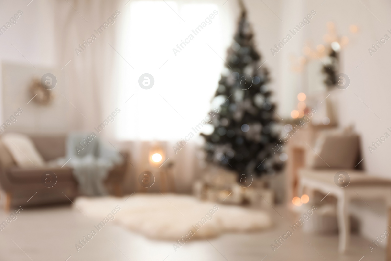 Photo of Blurred view of stylish living room interior with decorated Christmas tree