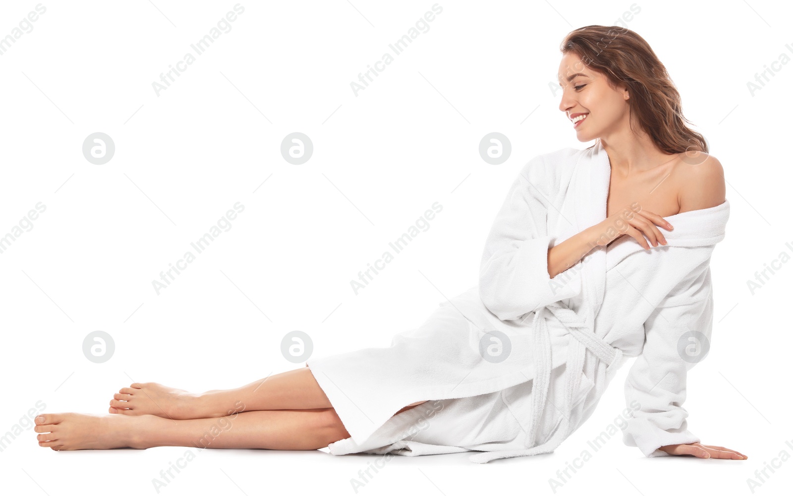 Photo of Beautiful young woman wearing bathrobe on white background