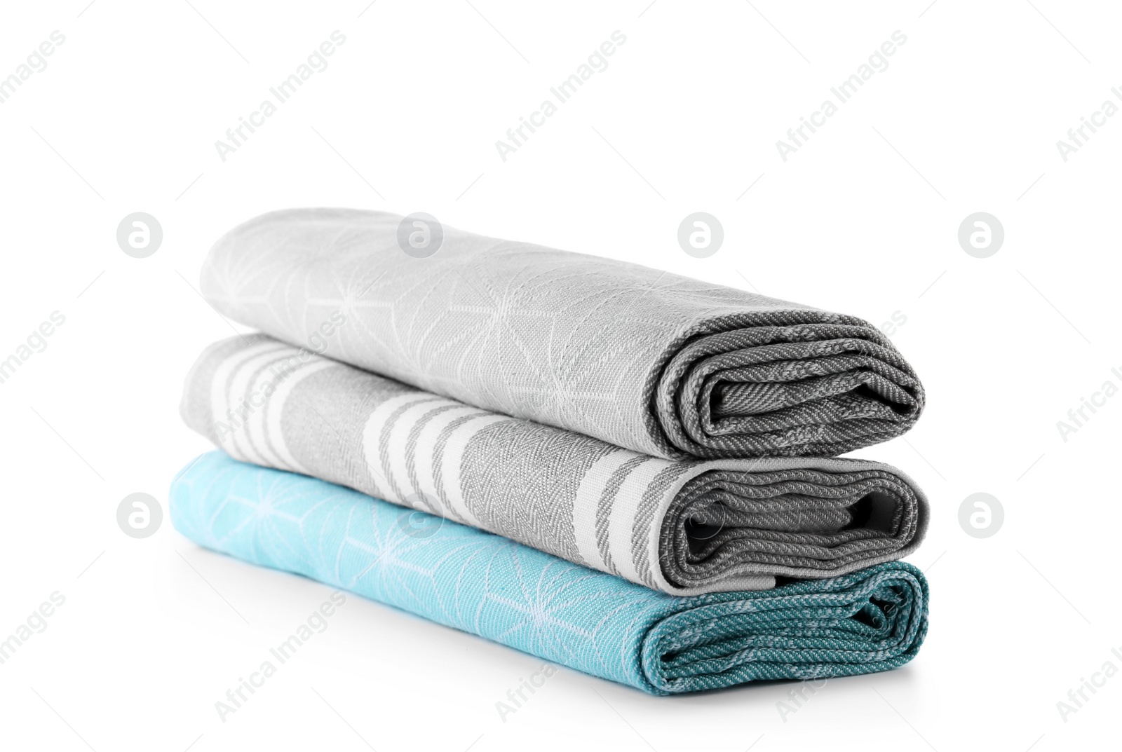 Photo of Rolled clean kitchen towels isolated on white