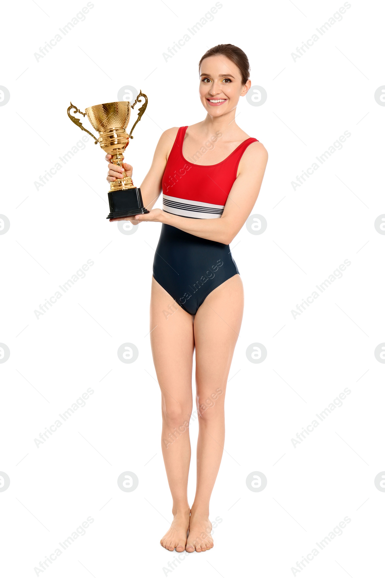 Photo of Young woman in swimwear holding golden cup on white background