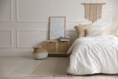 Comfortable bed with clean white linens indoors