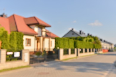 Photo of Blurred view of beautiful houses on sunny day