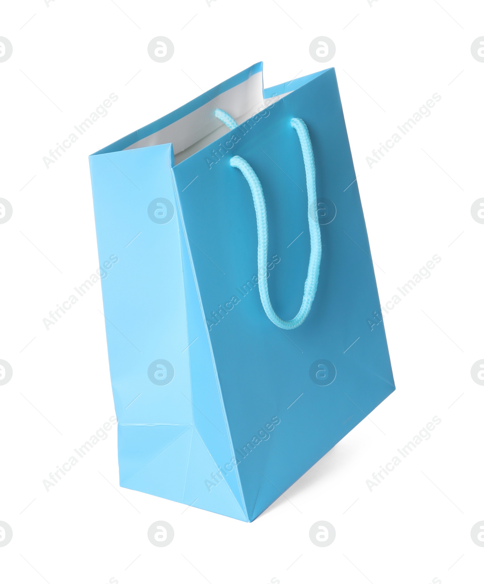 Photo of One light blue shopping bag isolated on white