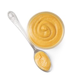 Fresh tasty mustard sauce in bowl and spoon isolated on white, top view