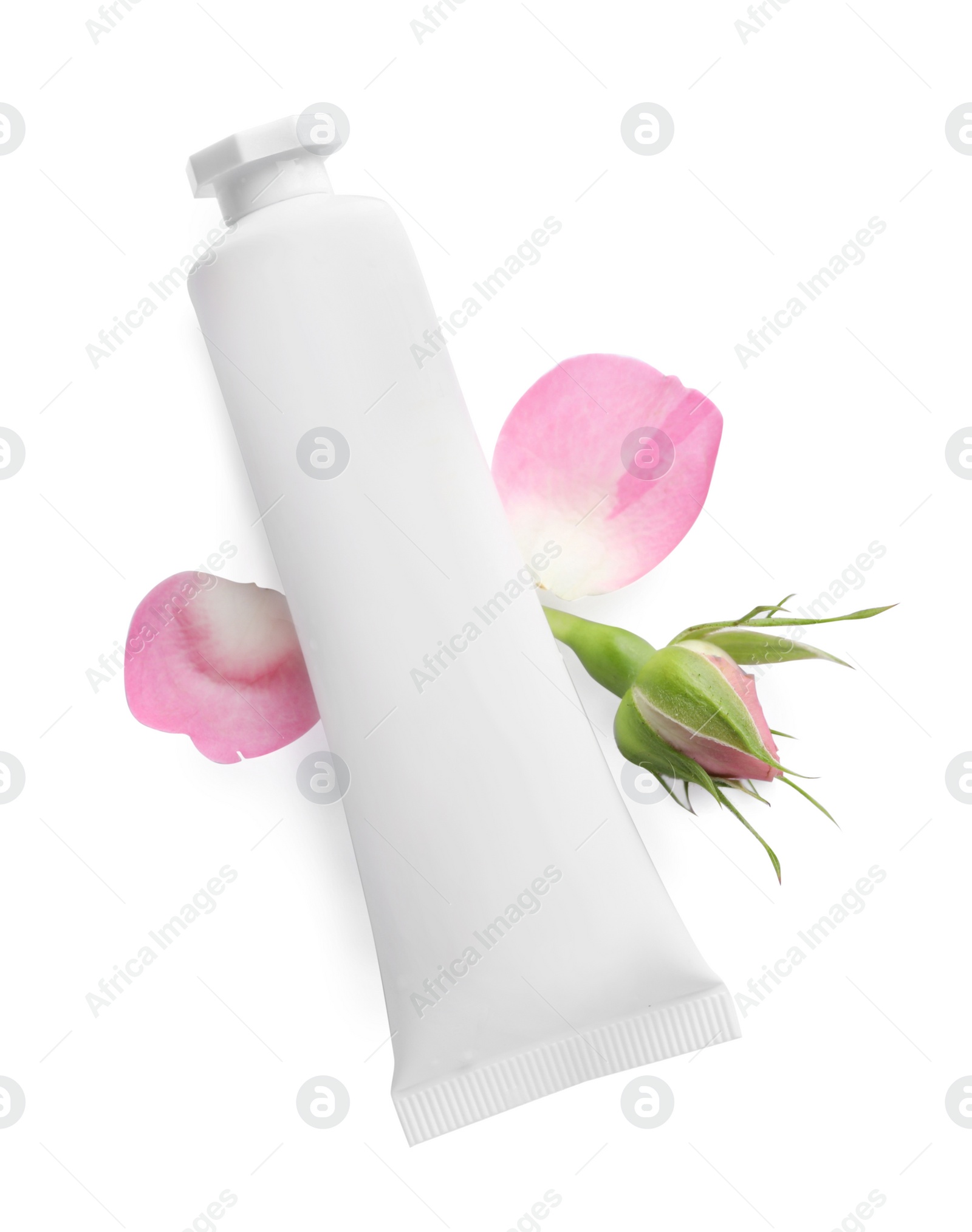 Photo of Tube of hand cream and roses on white background, top view