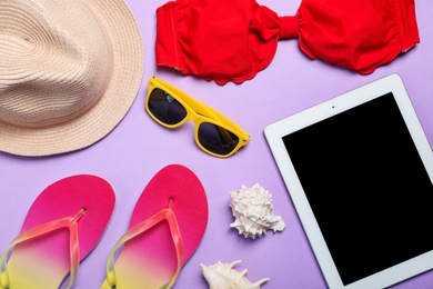 Photo of Flat lay composition with collection of beach objects on color background