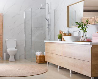 Photo of Interior of stylish bathroom with shower unit