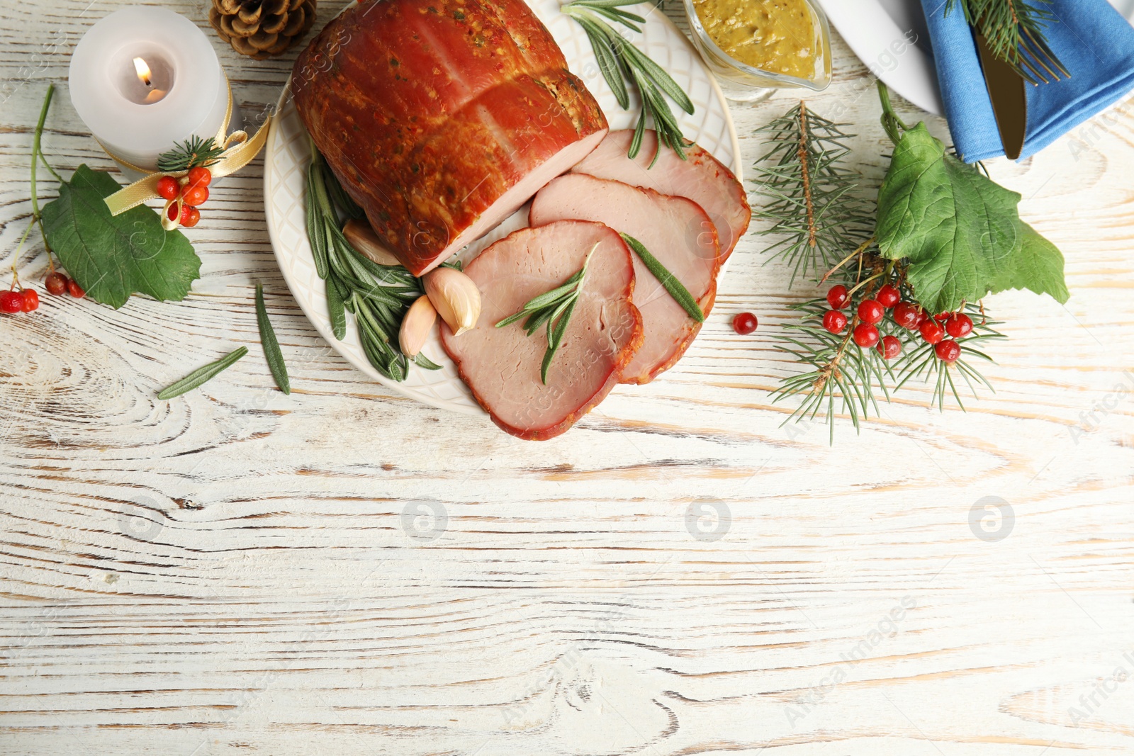 Photo of Flat lay composition with delicious ham on white wooden table, space for text. Christmas dinner