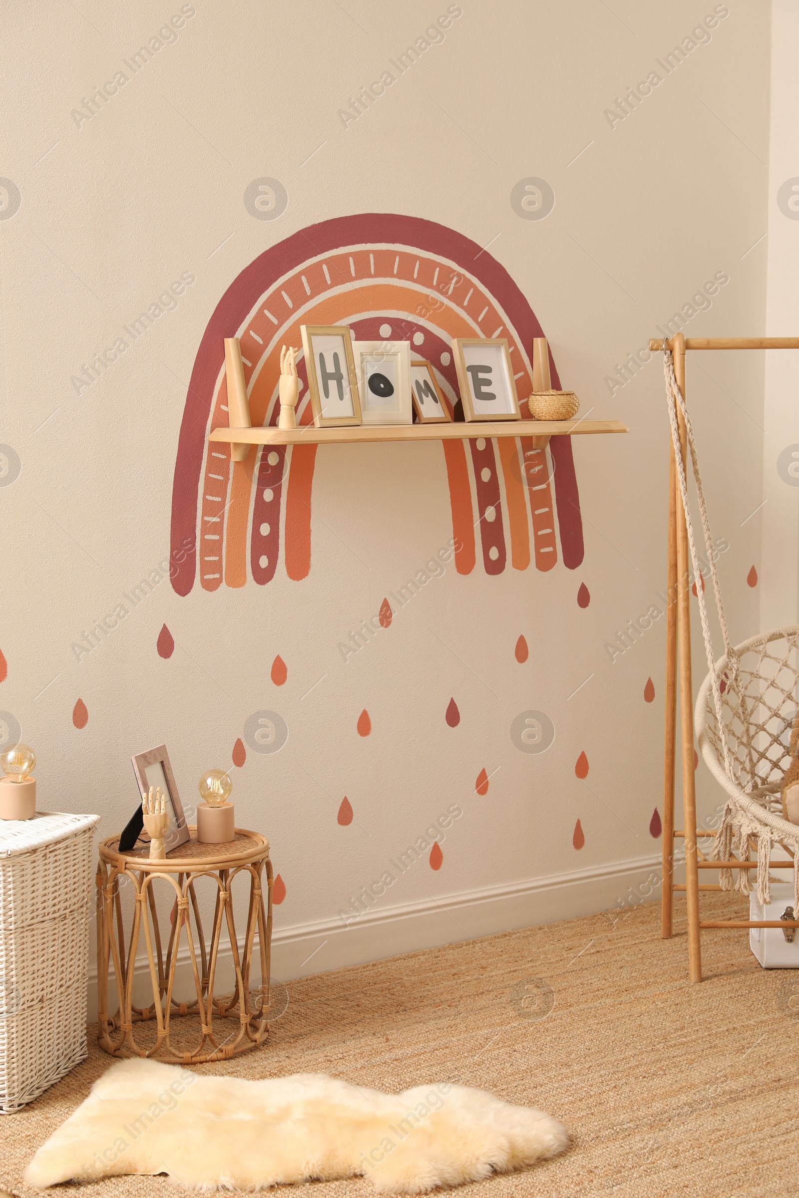 Photo of Child's room interior with rainbow painting on wall