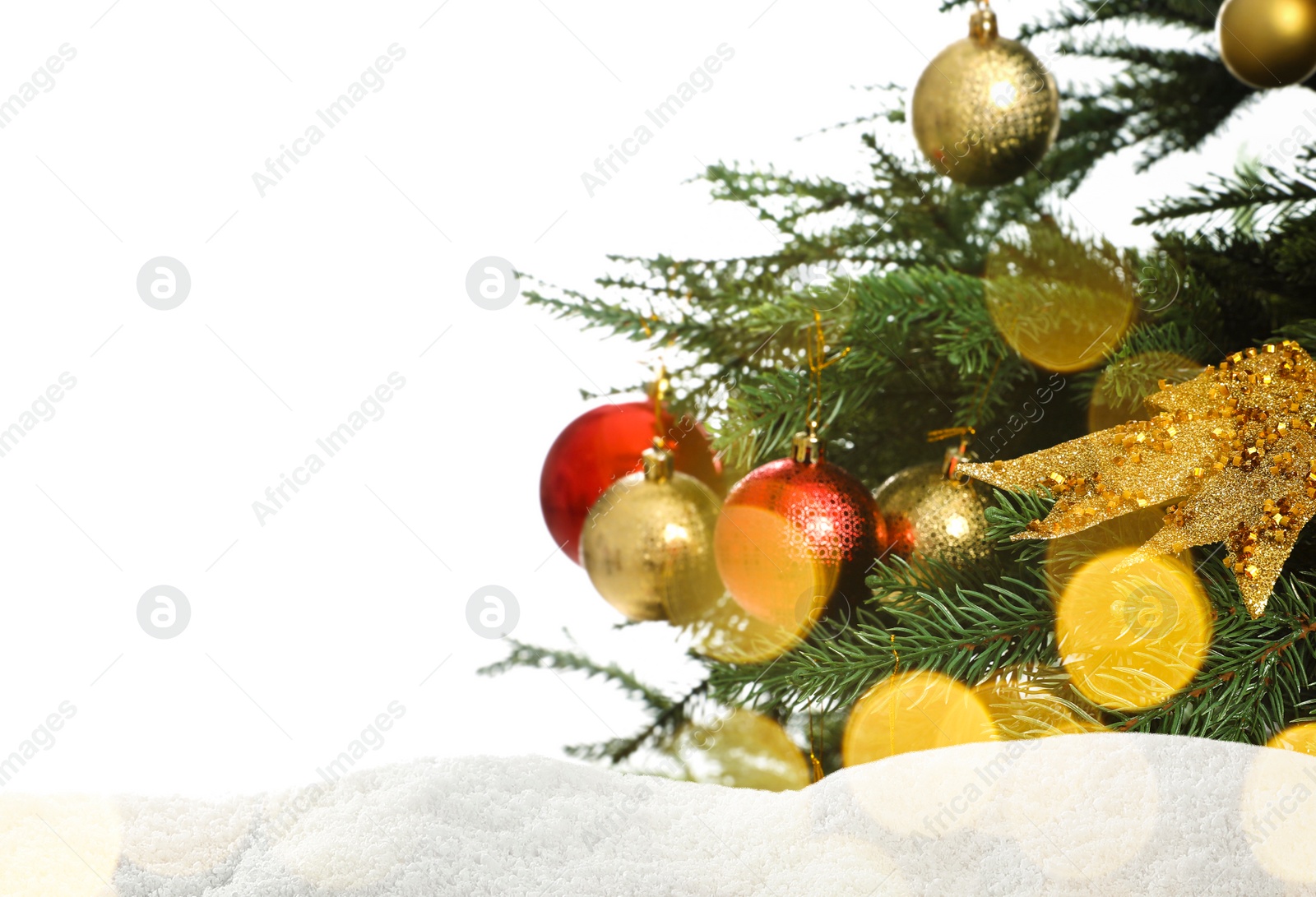 Image of Beautifully decorated Christmas tree and snow on white background, space for text. Bokeh effect