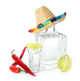 Photo of Mexican sombrero hat, tequila, chili peppers and limes isolated on white