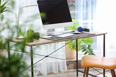 Light modern interior of working place with computer