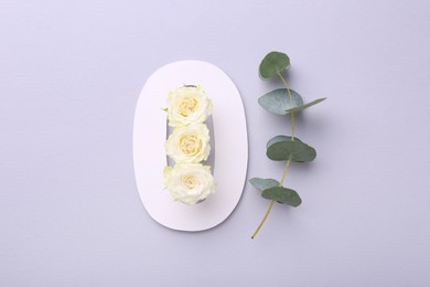 Photo of Paper number 0, beautiful flowers and eucalyptus branch on light grey background, top view