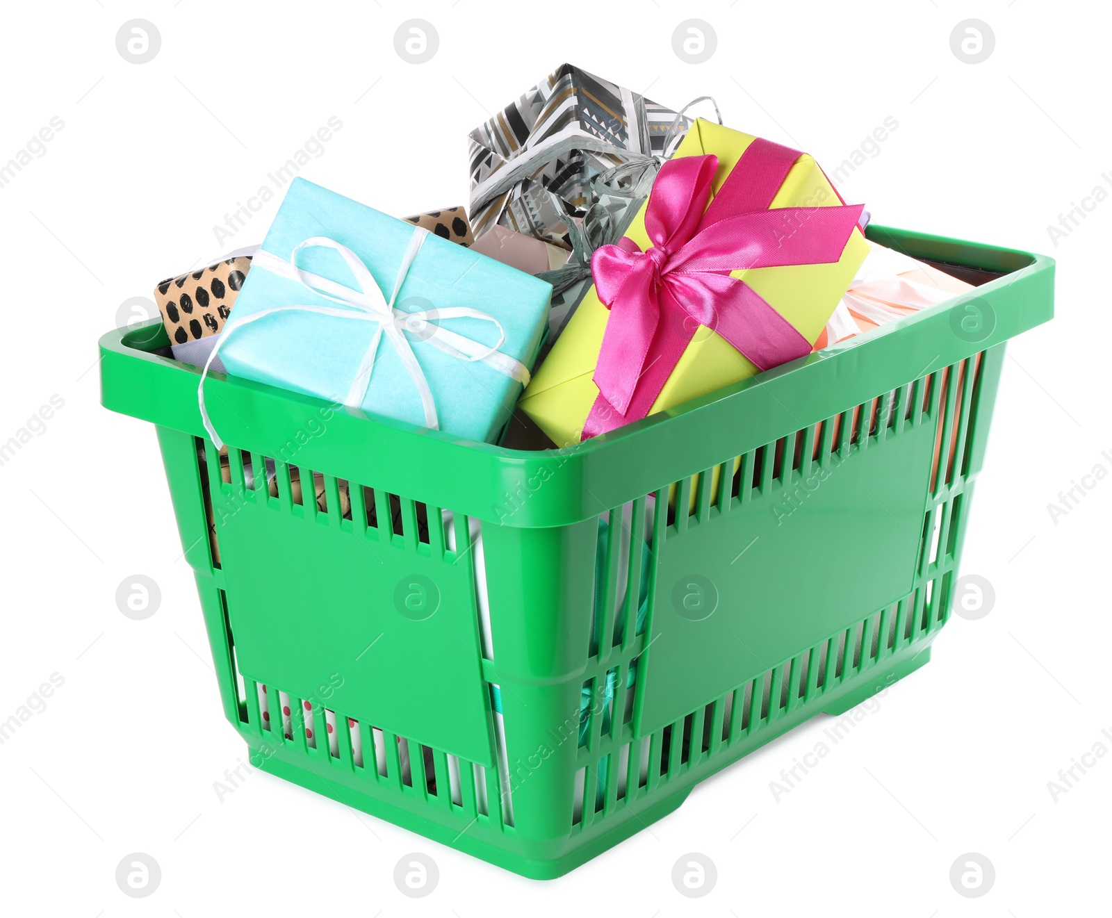 Photo of Green shopping basket with different gifts on white background