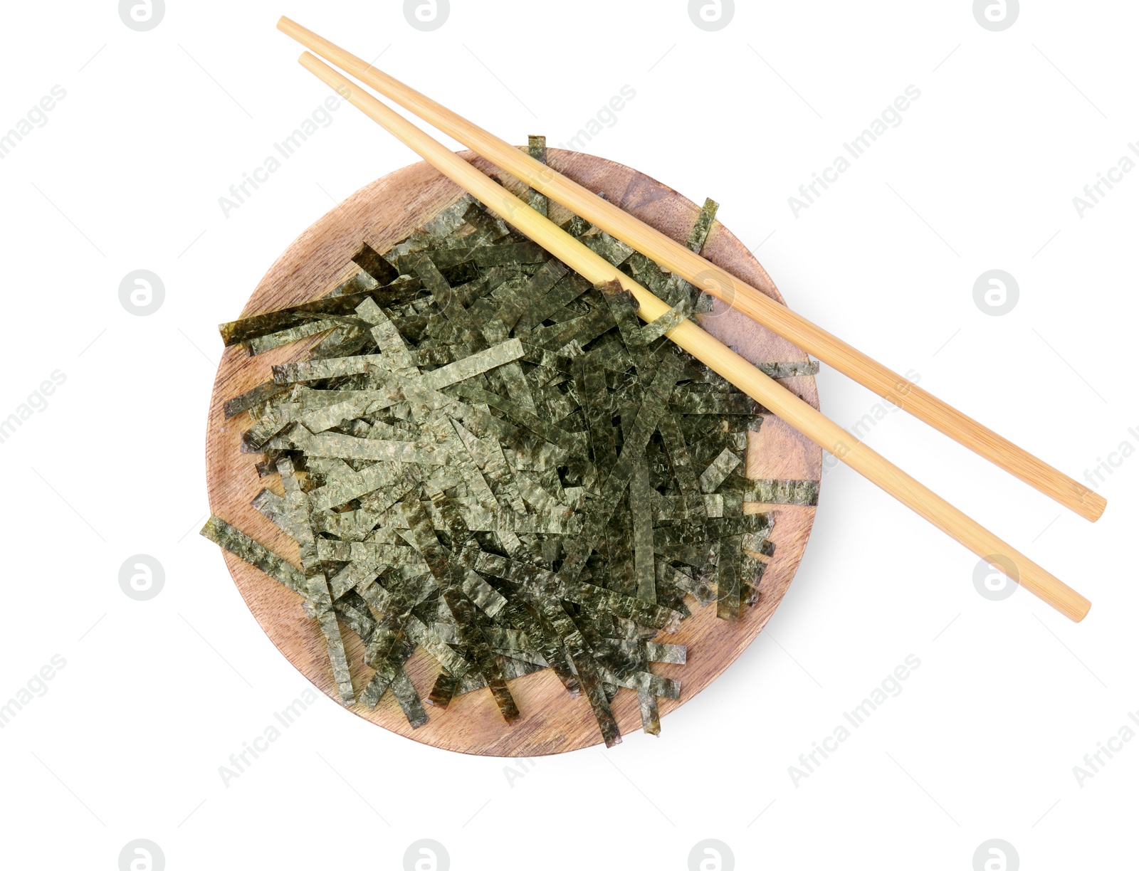 Photo of Wooden board with chopped crispy nori sheets and chopsticks isolated on white, top view