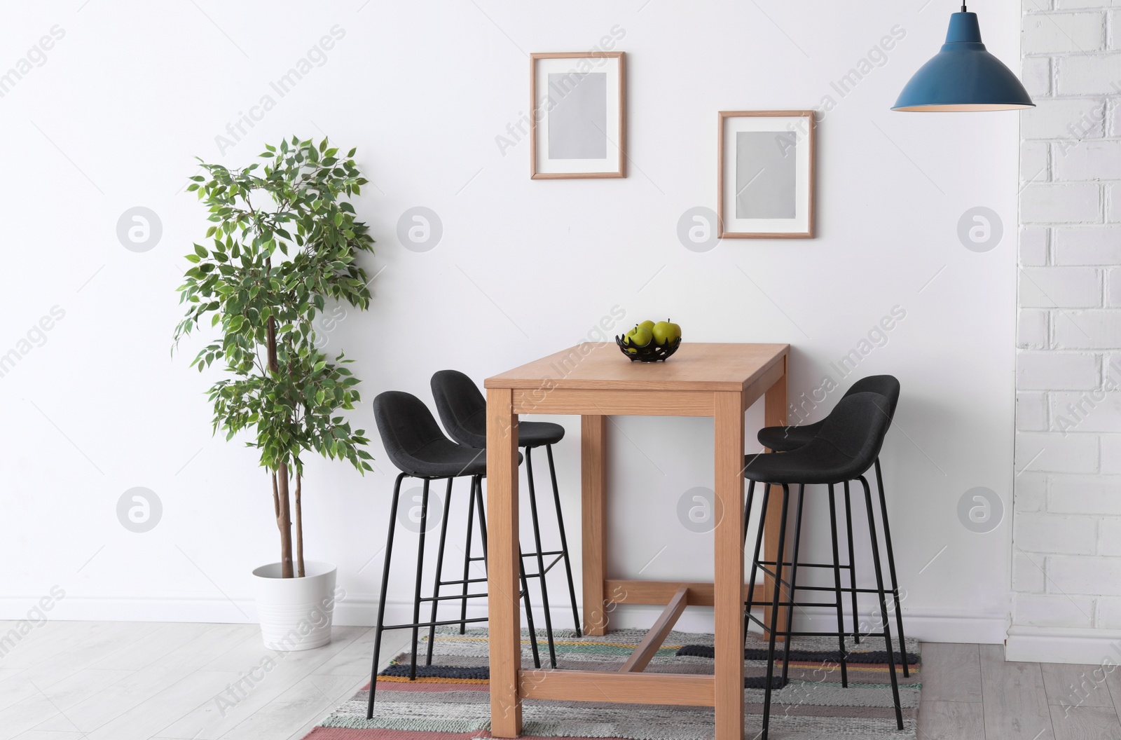 Photo of Stylish dining room interior. Home design idea