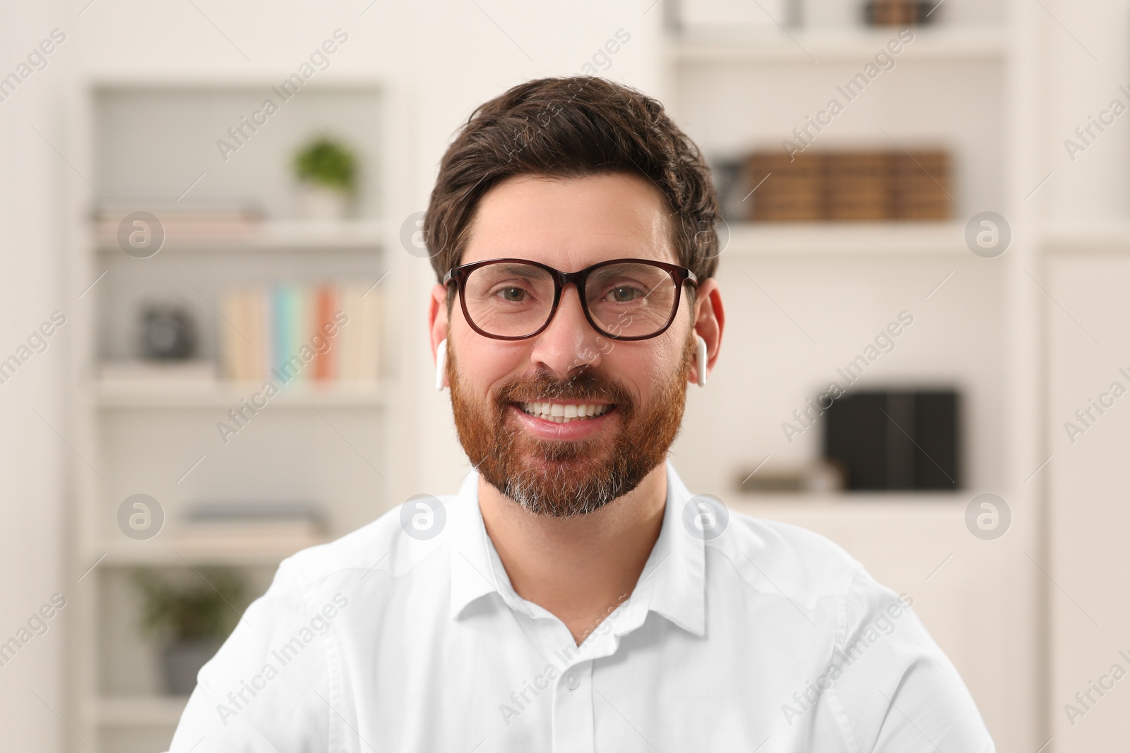 Photo of Happy businessman having online video call indoors, view from web camera