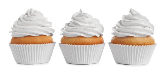 Photo of Delicious cupcakes decorated with cream on white background