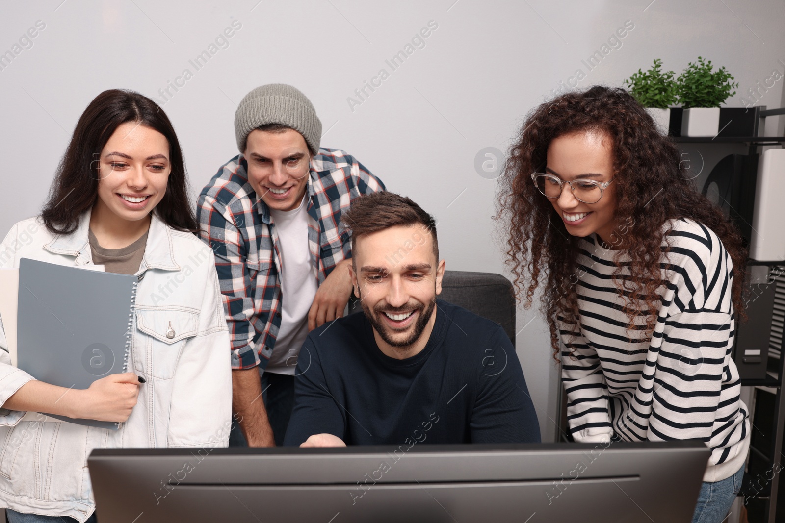 Photo of Team of employees working together in office. Startup project