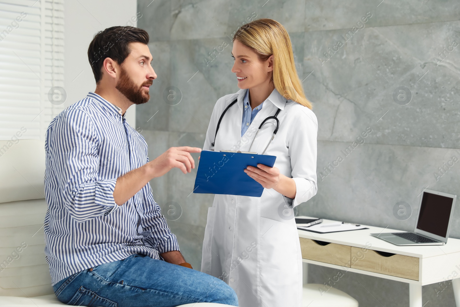 Photo of Patient having appointment with doctor in clinic