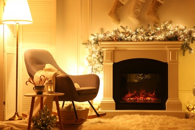 Fireplace in living room decorated for Christmas