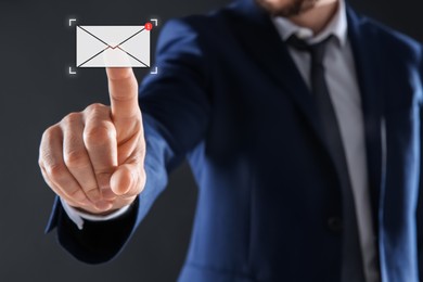 Image of Email. Man touching virtual screen with incoming letter notification against dark background, closeup