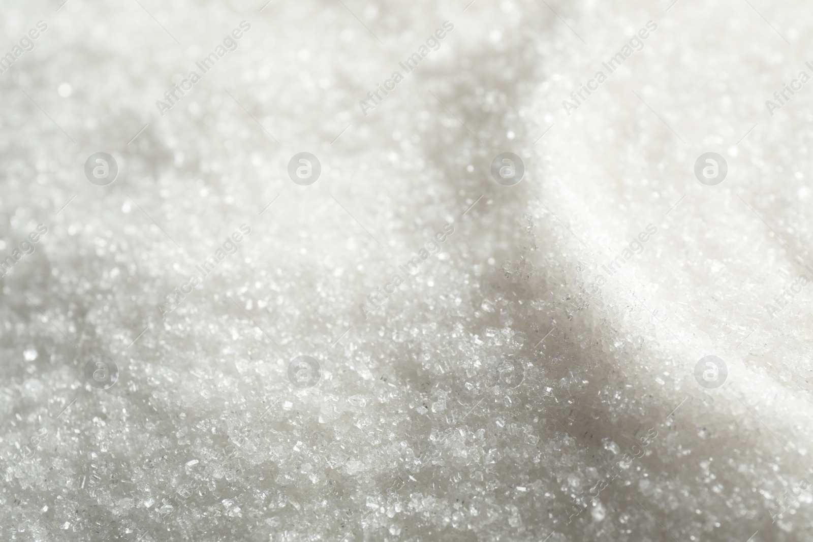 Photo of Pile of granulated sugar as background, closeup