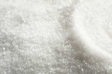 Photo of Pile of granulated sugar as background, closeup