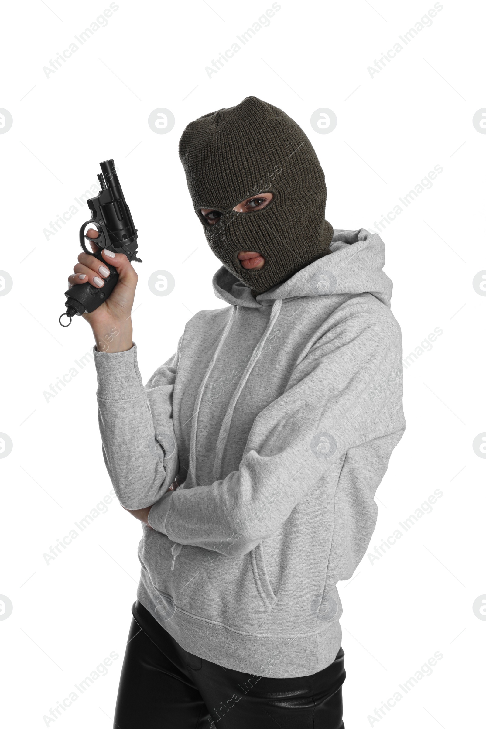 Photo of Woman wearing knitted balaclava with gun on white background