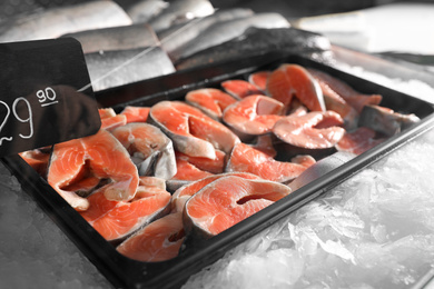 Steaks of fresh fish on ice in supermarket