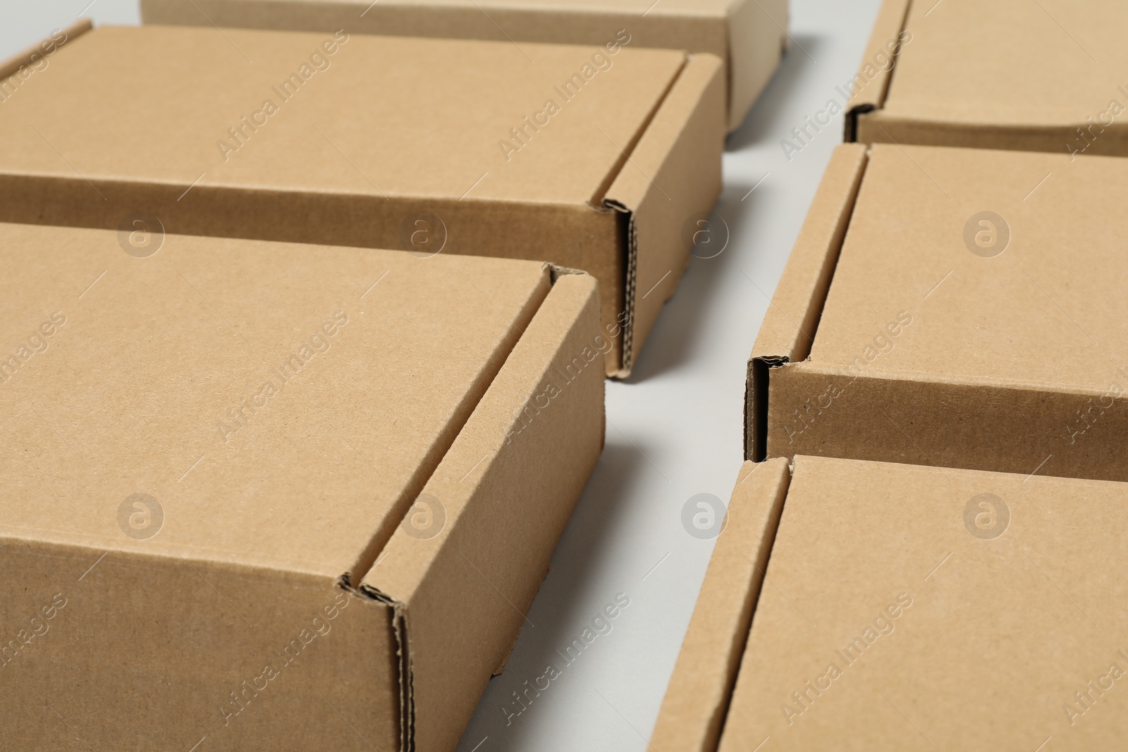 Photo of Many cardboard boxes on white background. Packaging goods