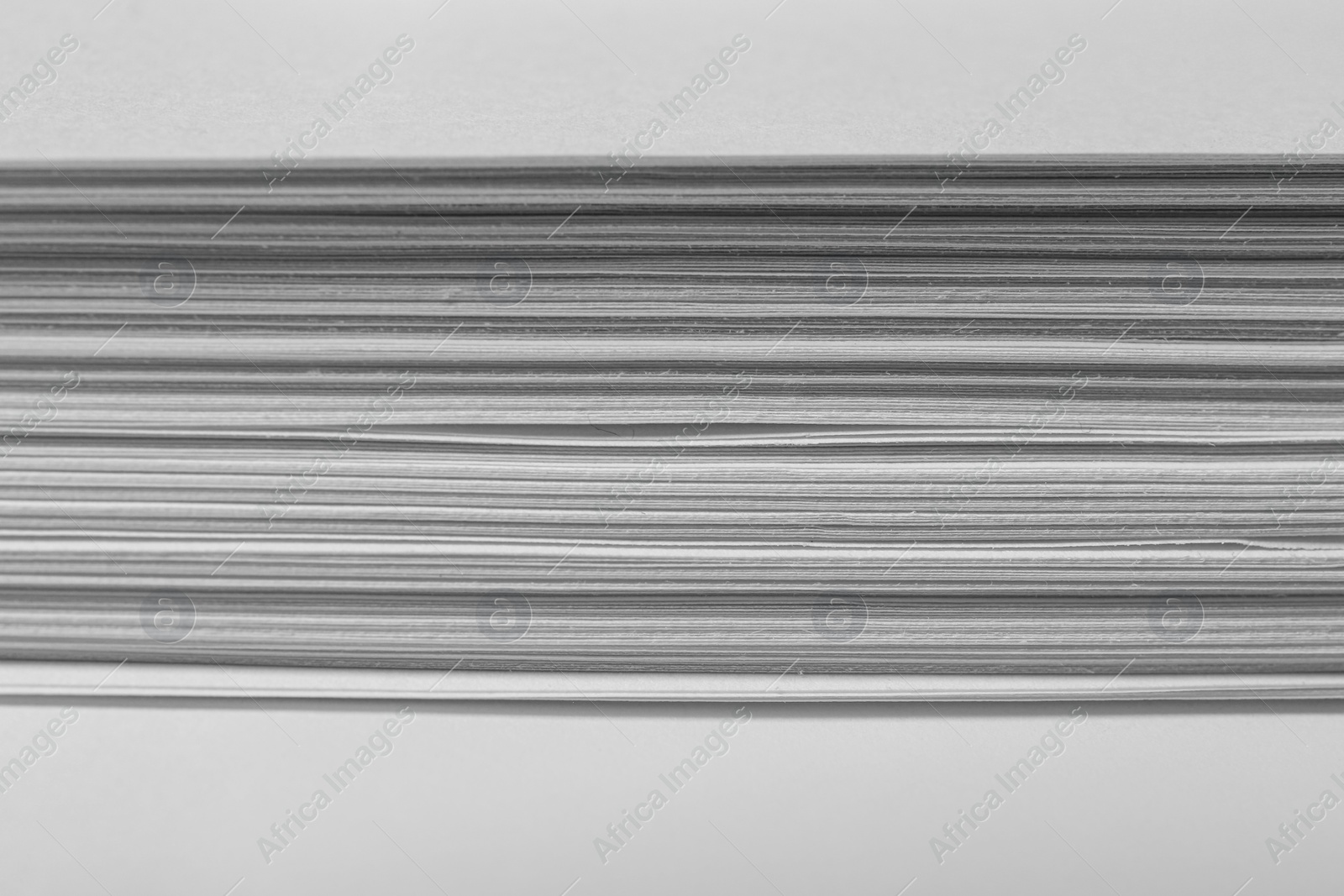 Photo of Stack of paper sheets as background, closeup