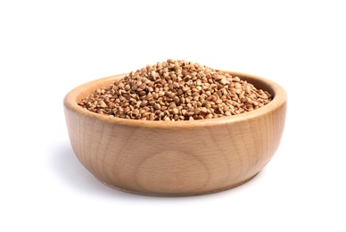 Bowl with uncooked buckwheat on white background